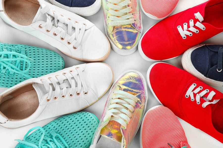 A diverse collection of stylish sneakers for women in various colors and designs.