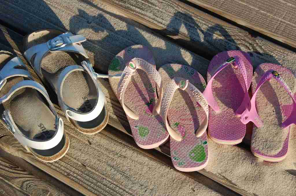 Women enjoying a day at the beach in stylish and comfortable sandals.